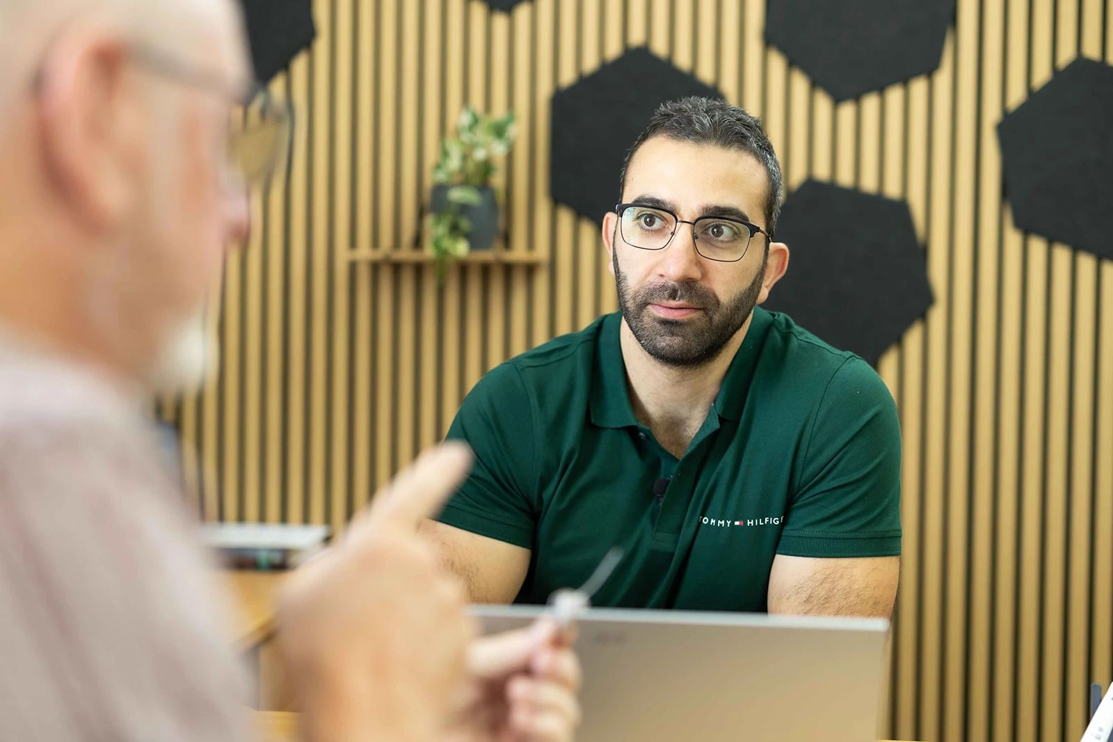 Audiologist at Holistic Hearing Solutions listening to client