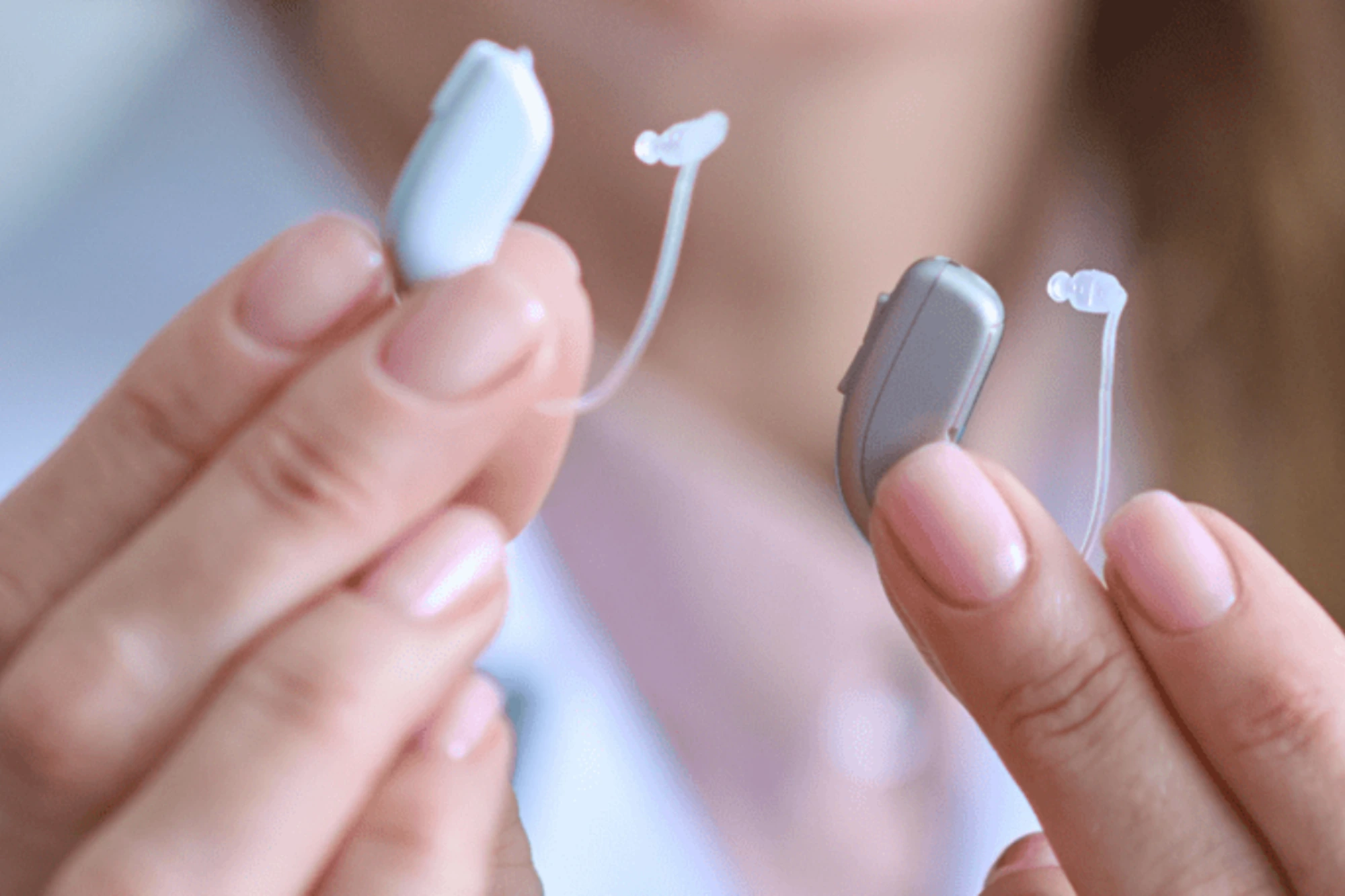 HAs-Woman holding Hearing aids