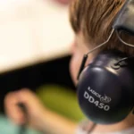 Holistic Hearing young person with earphones